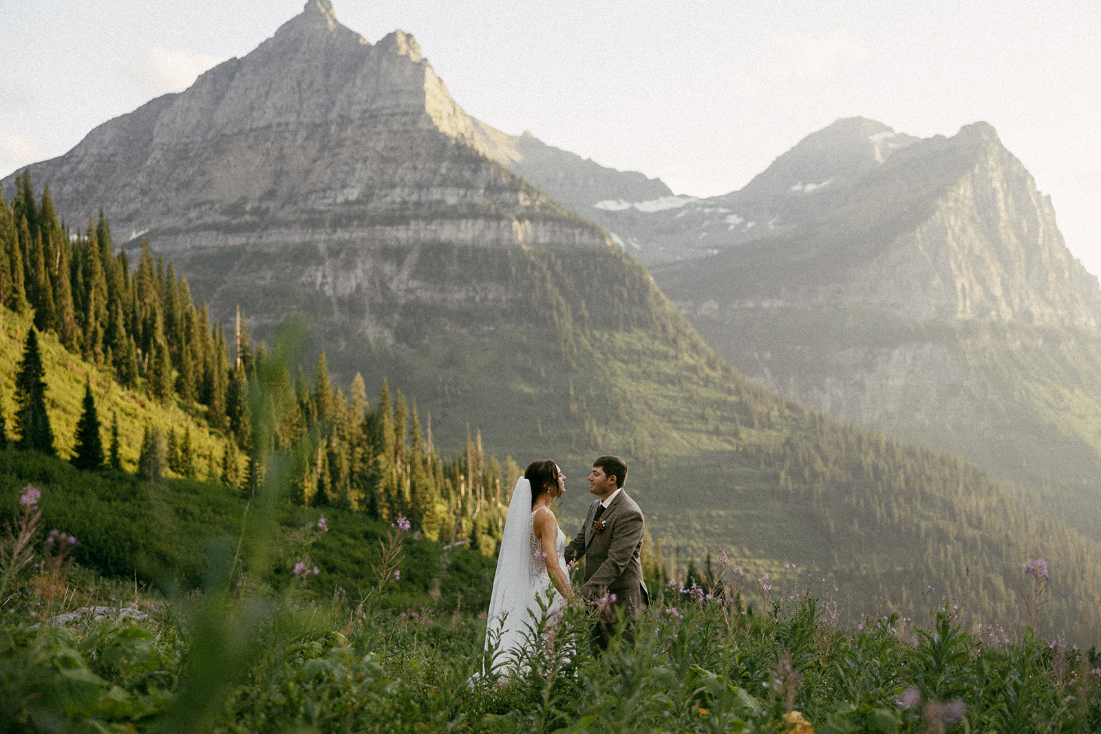 Bride and Groom elope in Glacier National Park surrounded by wildflowers