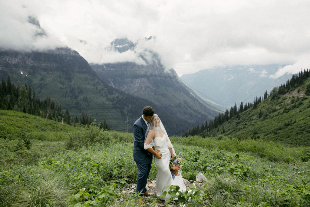 Bride and groom eloping in glacier national park at Big Bend