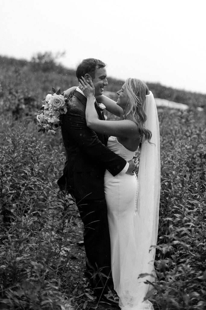 Bride and groom eloping in the rain in glacier national park at Big Bend