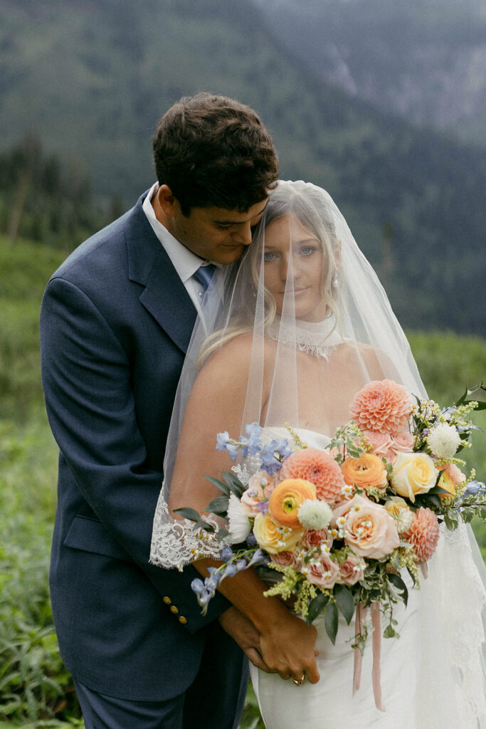 Bride and groom on their elopement day at Big Bend in Glacier National Park