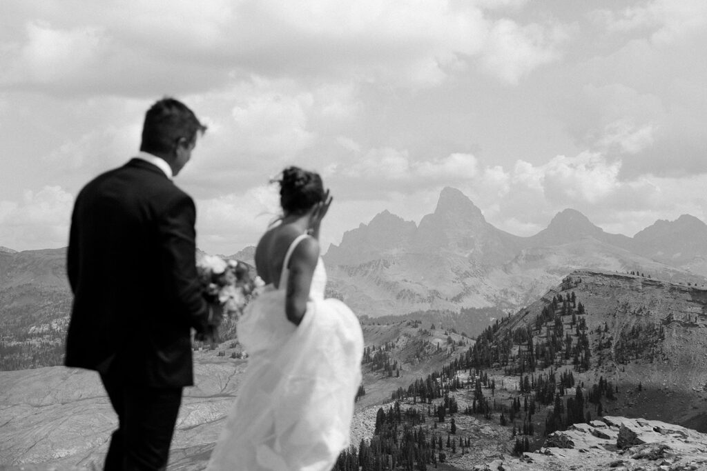 Bride and groom at the top of Grand Targhee Resort, overlooking Grand Teton National Park