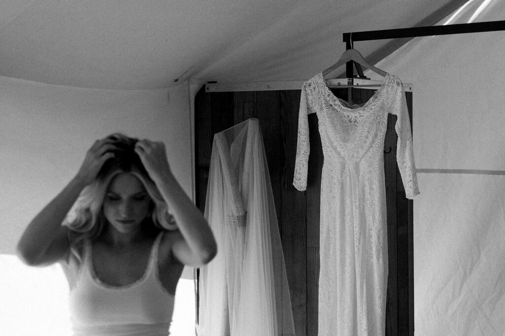 Bride getting ready for her Glacier National Park elopement at Under Canvas